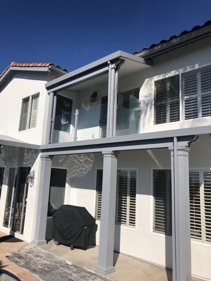 Multi-family building exterior with painted trim and shutters