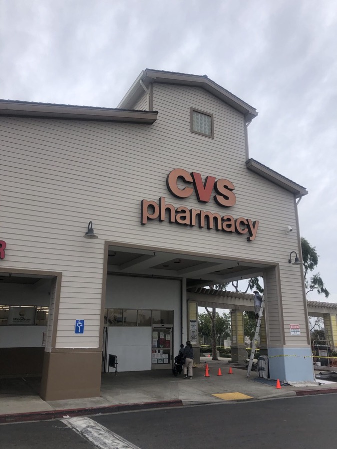 Retail pharmacy storefront with repainted facade