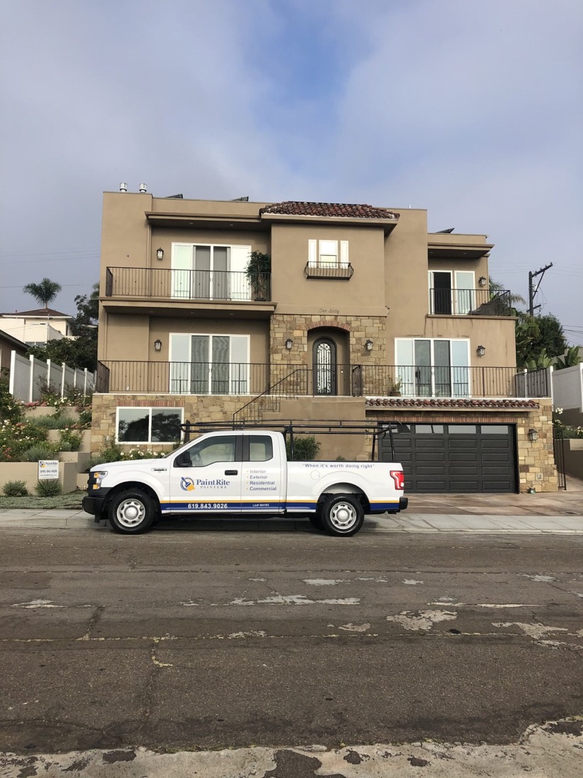 Two-story stucco home repainted by PaintRite in San Diego